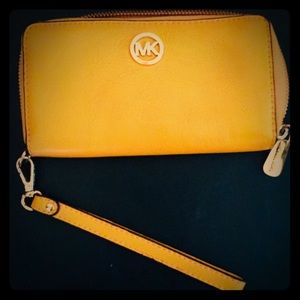 Yellow Michael Kors clutch wallet